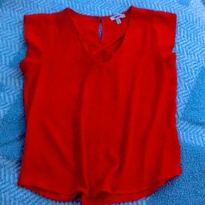 Red polyester V-neck blouse (used)